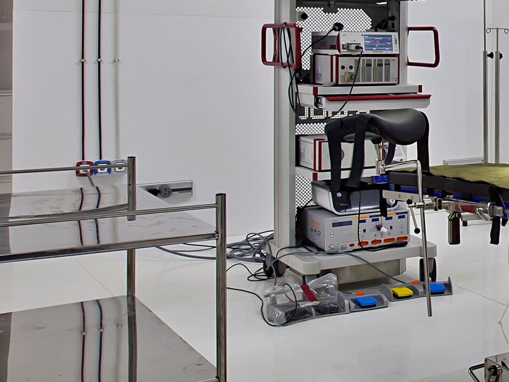 Surgical video tower with stacked console, light source, and camera unit