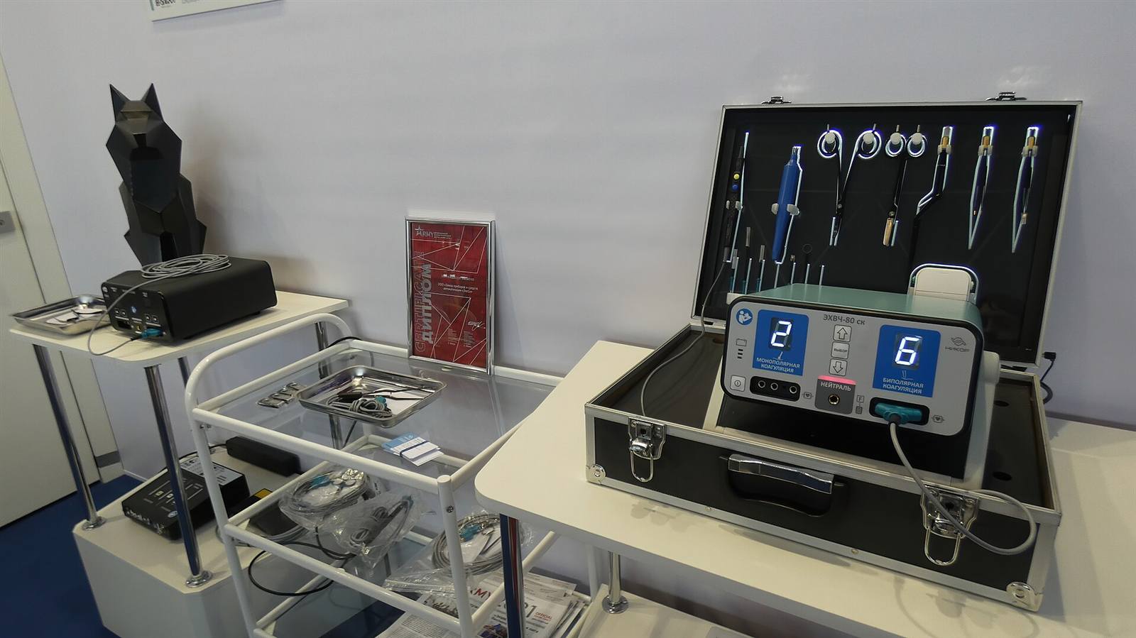 Portable electrosurgical generator with monopolar and bipolar coagulation output displays, plus a set of electrosurgical pencils and bipolar forceps