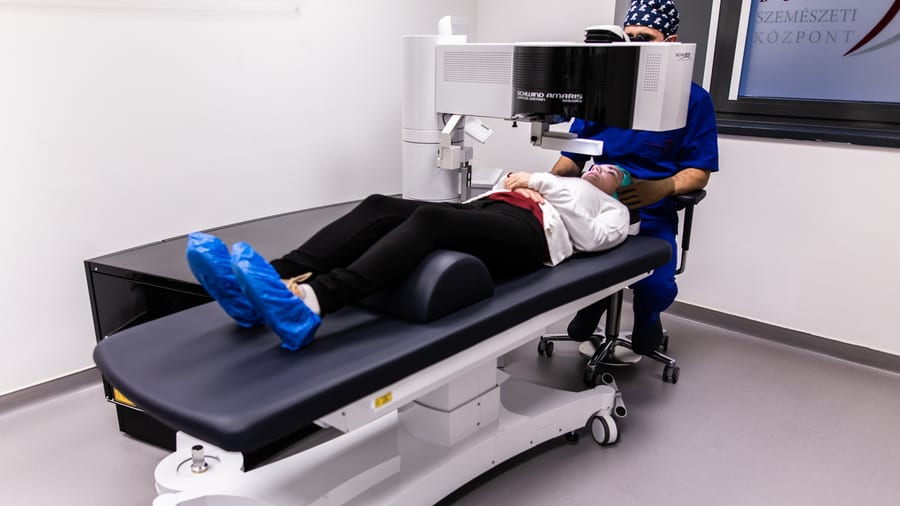 Ophthalmic surgical system positioned over a procedure table