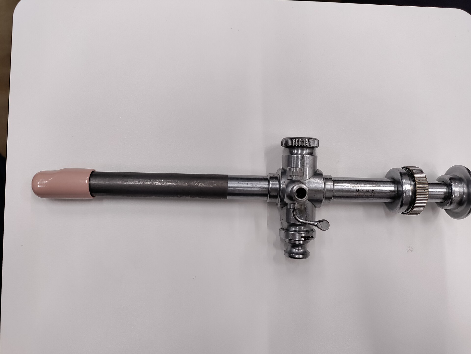 Rigid laparoscope with light-guide post