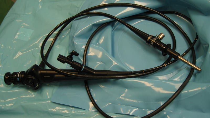A flexible urologic endoscope (cystoscope/ureteroscope) with a control handle and a thin deflectable insertion tube