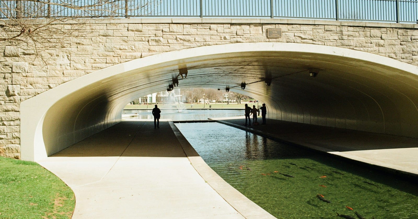 Stone arch footbridge over a park canal in downtown Huntsville, Alabama