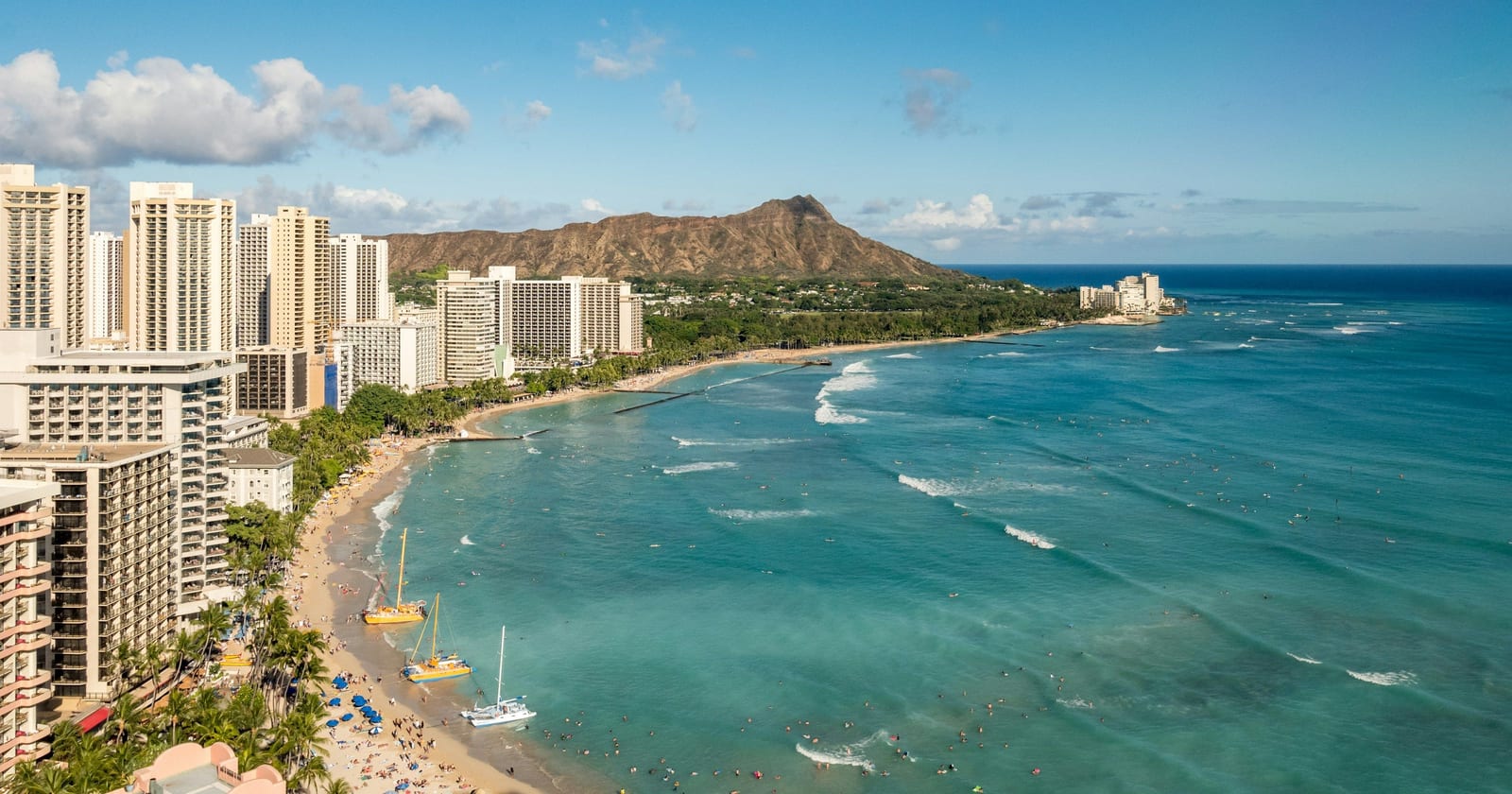 Waikiki Beach hotels curving toward Diamond Head, Honolulu, Hawaii