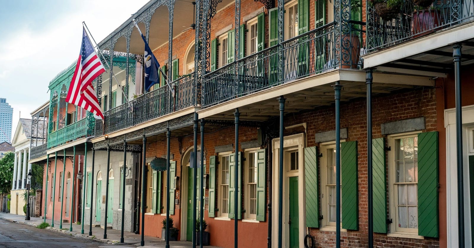 Street of cast-iron balconies and green shutters, New Orleans, Louisiana