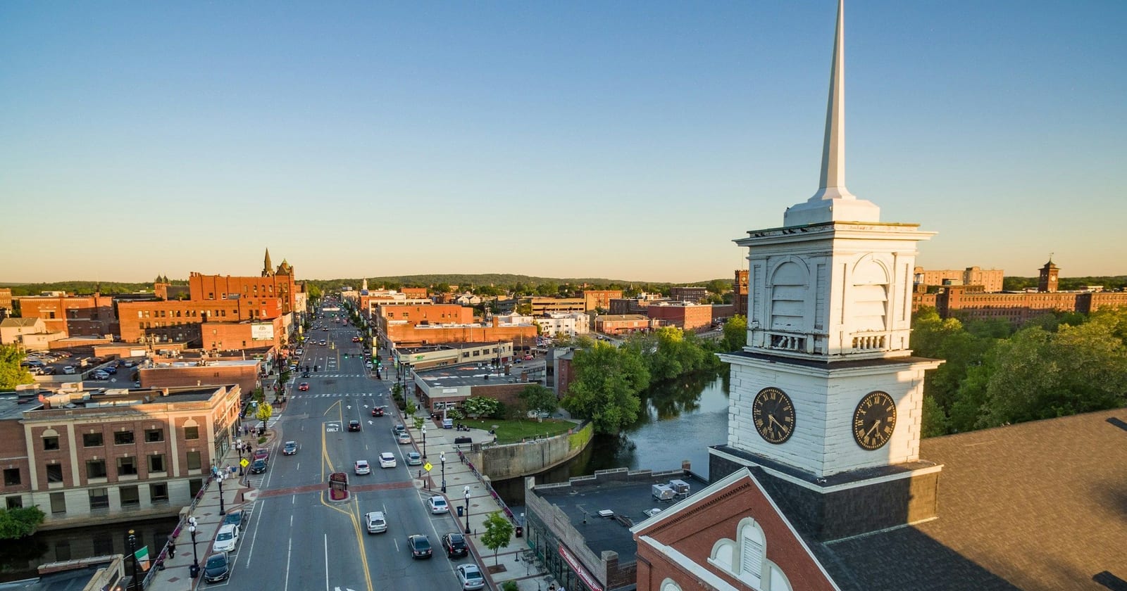 Aerial view of downtown Nashua past a church clock steeple, New Hampshire