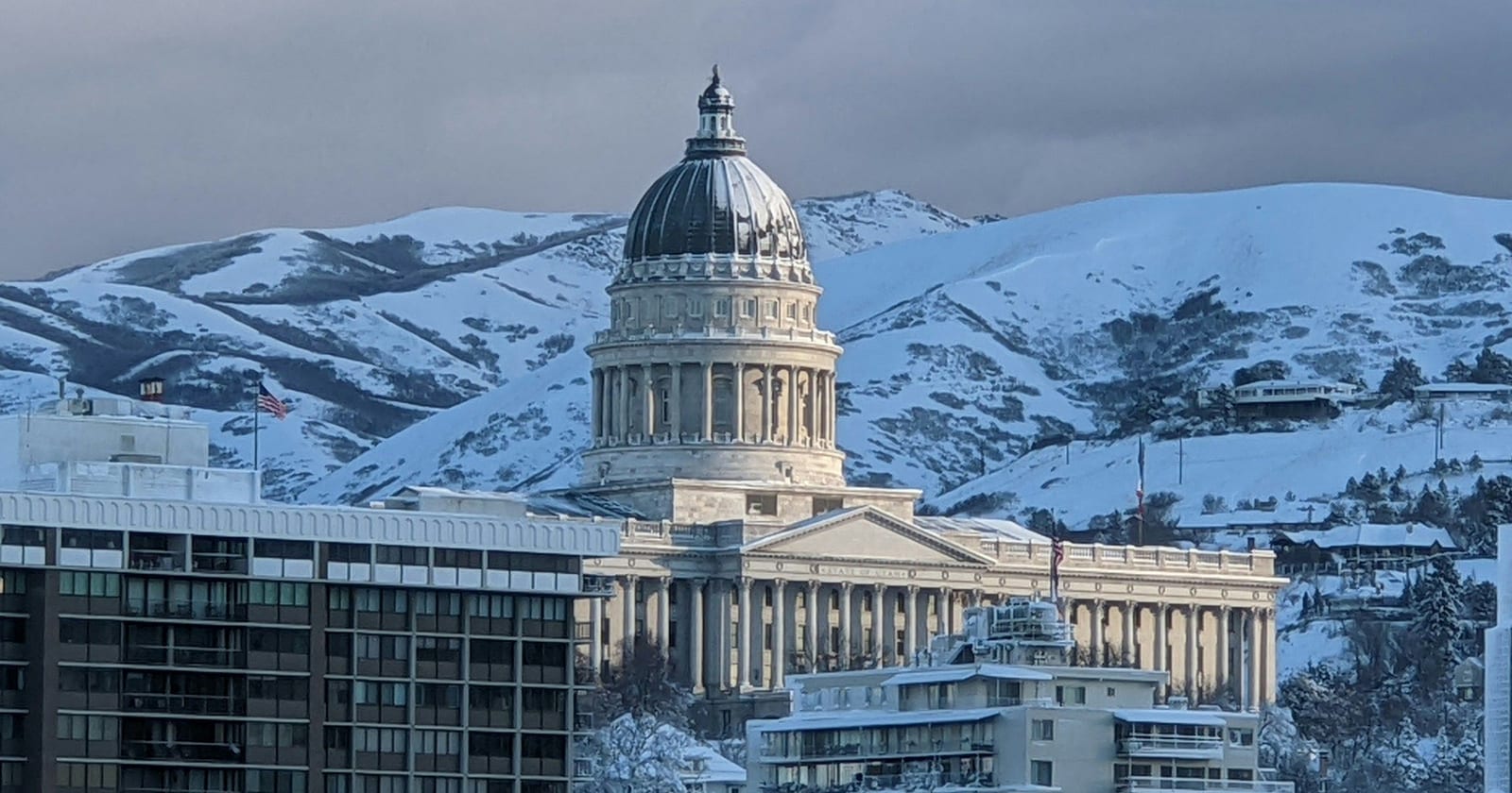 Utah State Capitol dome with snow-covered foothills behind, Salt Lake City, Utah