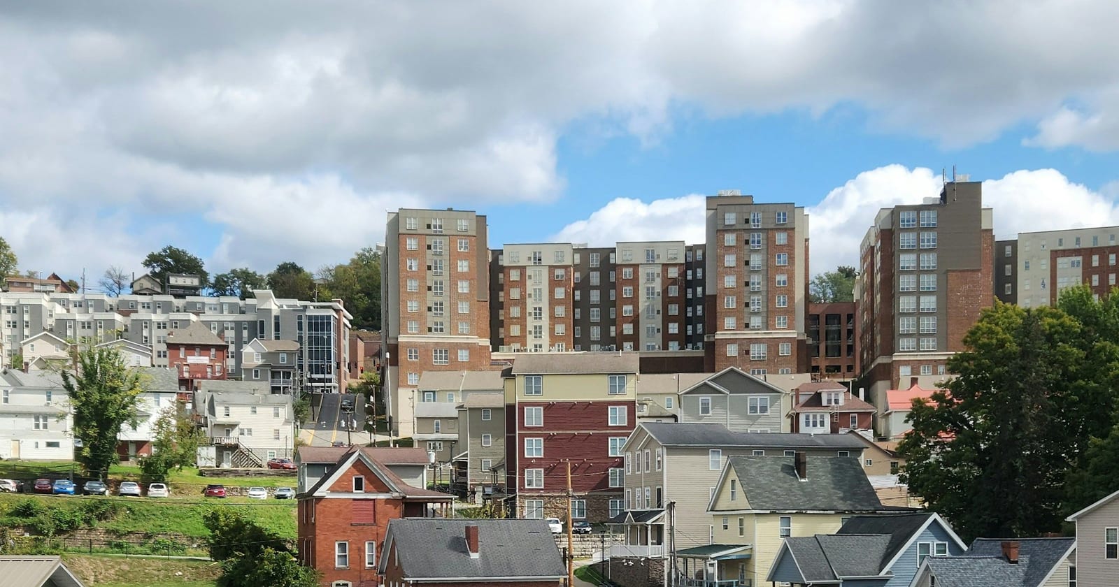 Student high-rises above older hillside houses, Morgantown, West Virginia